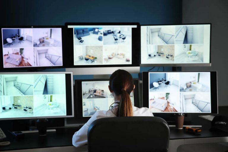 Woman Guard Watching Business CCTV for Crime
