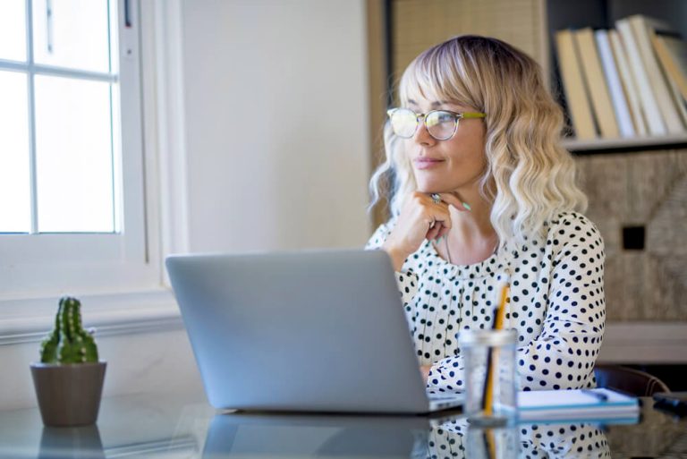 What a Divorce Lawyer Learned From a Psychic About Women and Reinvention Female Business Woman looking out of window in reflective pose