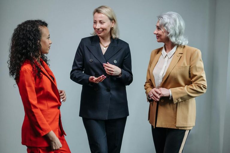 Rising Together: A New Definition of World-Class Leadership Group f 3 women in business suits