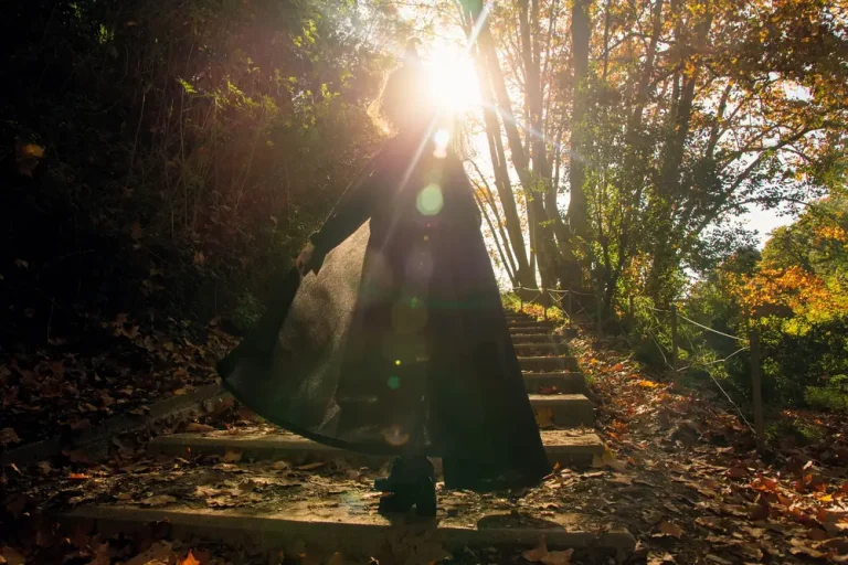 The Awakening Journey: What It Really Means to Come Home to Yourself Woman Walking into the Sunlight