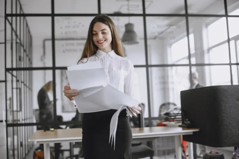 Smiling Woman with Papers
