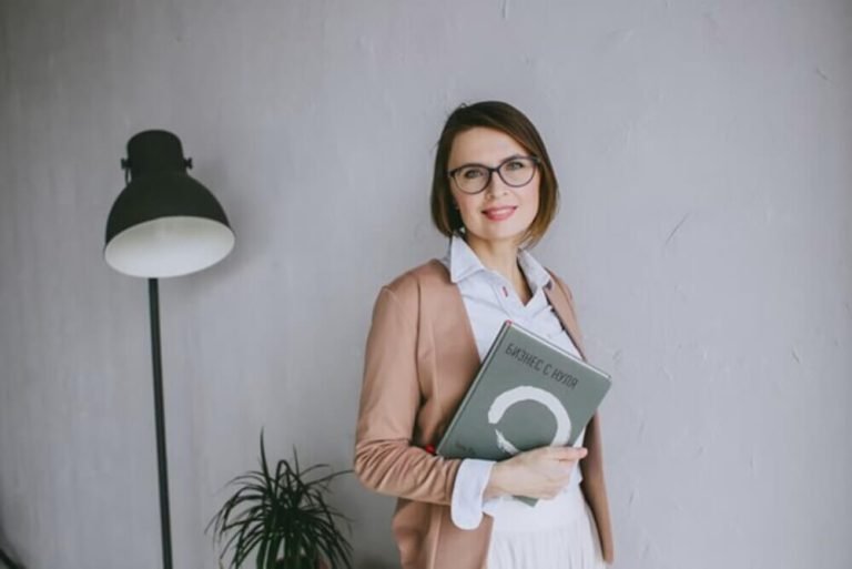Career Advancement Strategies: Empowerment Tools for Modern Women Woman holding notepad